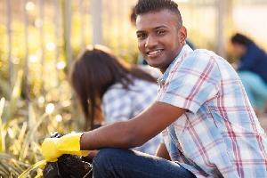 Employee volunteers engaged in cleaning up community