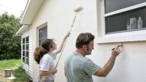 Father and Daughter volunteer for Habitat for Humanity